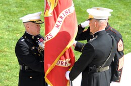 Gen. James Amos recieves the Marine Corps Colors from Gen. James T. Conway during a change-of-command ceremony at Marine Barracks Washington Oct. 22. Conway relinguished command of the Marine Corps to Amos, who became the 35th Commandant of the Marine Corps.